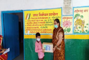 Each happiness kit contains essential grocery and academic necessities