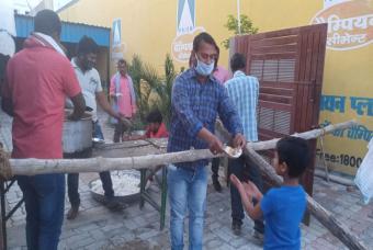 Fresh food being handed out to a beneficiary